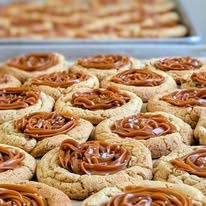 Cookies with caramel centers on a baking tray