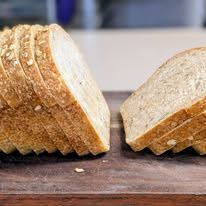 A sliced loaf on a wooden board