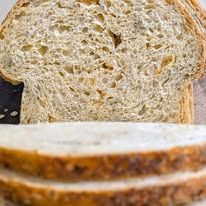 A close-up of sliced sourdough showing its soft crumb